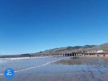 View of Pismo Beach pier and mountains
